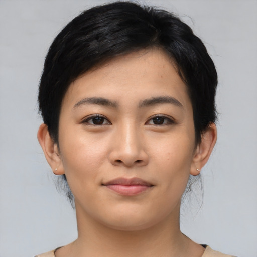 Joyful asian young-adult female with medium  black hair and brown eyes