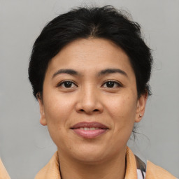 Joyful asian young-adult female with short  brown hair and brown eyes