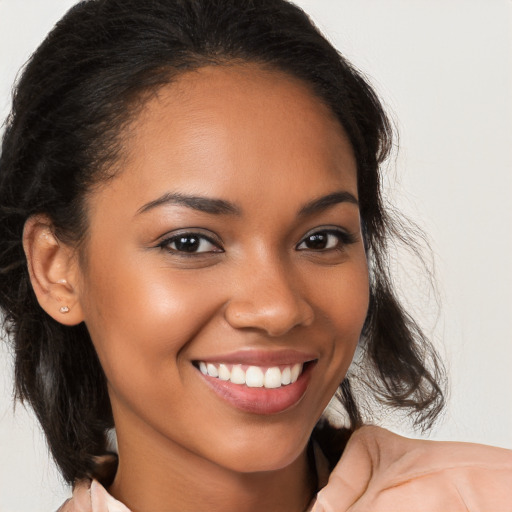 Joyful latino young-adult female with medium  brown hair and brown eyes