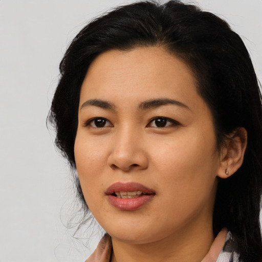 Joyful asian young-adult female with medium  black hair and brown eyes