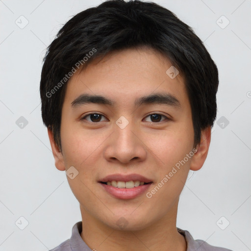 Joyful asian young-adult male with short  black hair and brown eyes