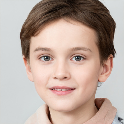 Joyful white child female with short  brown hair and grey eyes