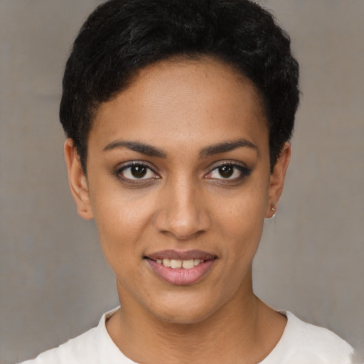 Joyful latino young-adult female with short  black hair and brown eyes