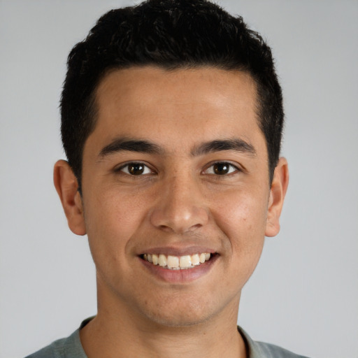 Joyful white young-adult male with short  black hair and brown eyes