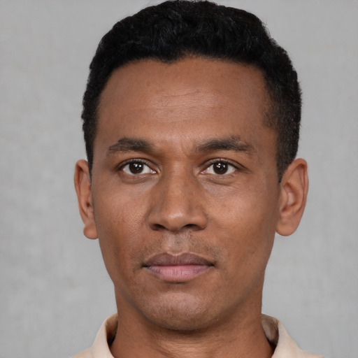 Neutral latino young-adult male with short  black hair and brown eyes