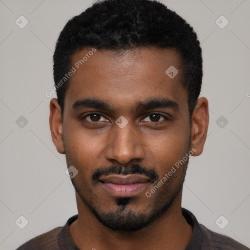 Joyful black young-adult male with short  black hair and brown eyes