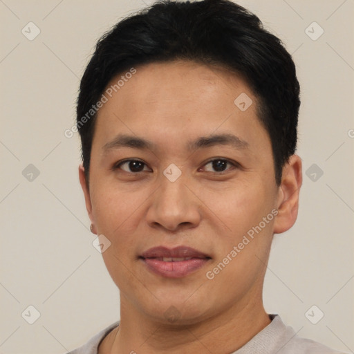 Joyful asian young-adult male with short  black hair and brown eyes