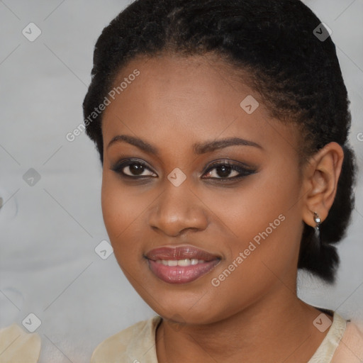 Joyful black young-adult female with short  brown hair and brown eyes
