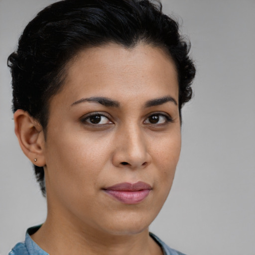 Joyful latino young-adult female with short  brown hair and brown eyes