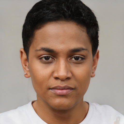 Joyful black young-adult female with short  black hair and brown eyes
