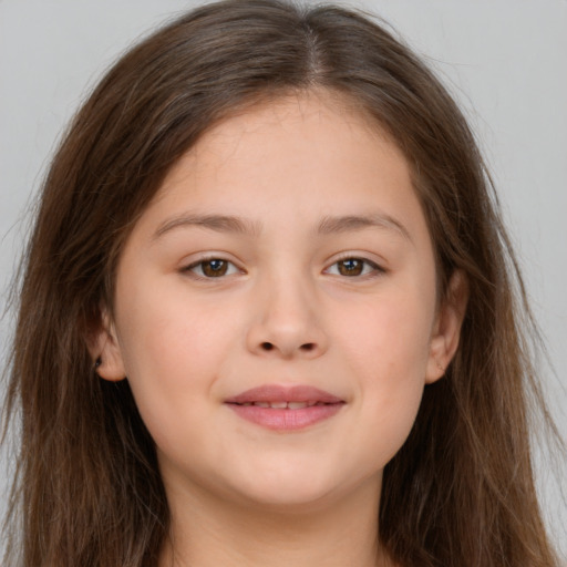 Joyful white child female with long  brown hair and brown eyes