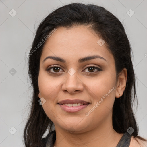 Joyful latino young-adult female with long  brown hair and brown eyes