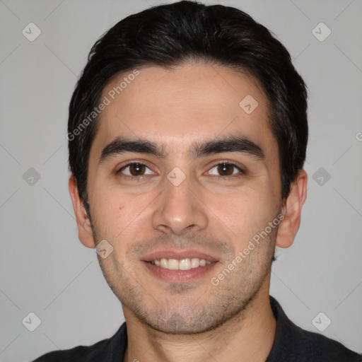 Joyful white young-adult male with short  black hair and brown eyes