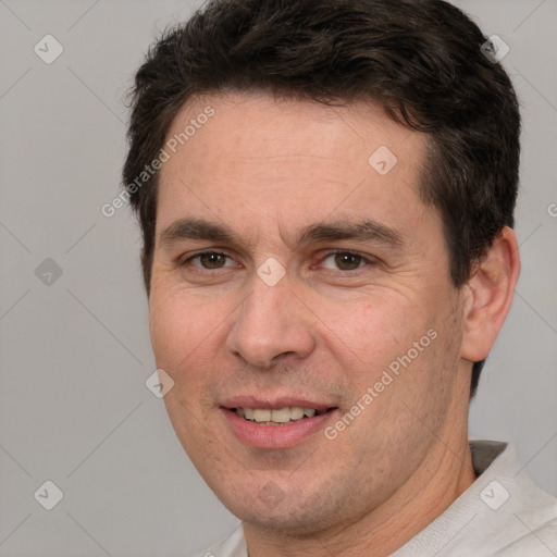 Joyful white adult male with short  brown hair and brown eyes