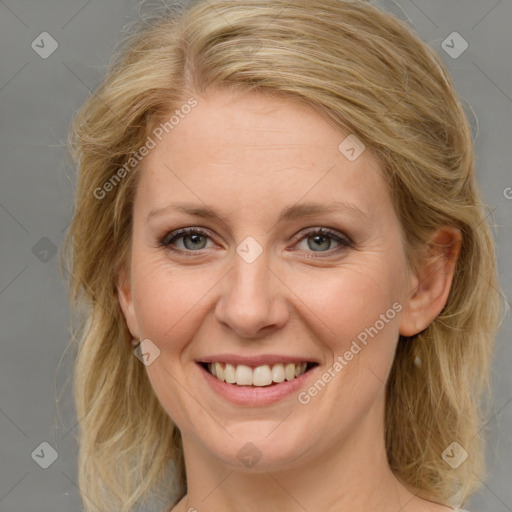 Joyful white young-adult female with medium  brown hair and blue eyes