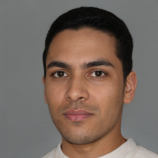 Neutral latino young-adult male with short  black hair and brown eyes