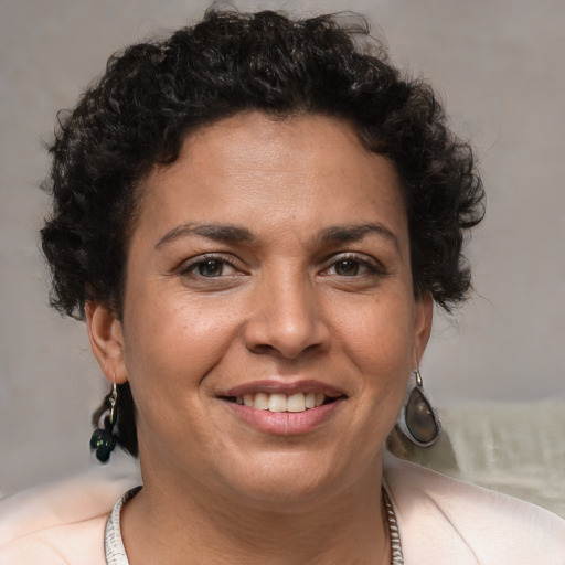 Joyful white adult female with short  brown hair and brown eyes