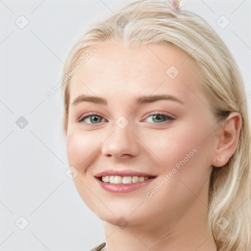 Joyful white young-adult female with long  brown hair and blue eyes