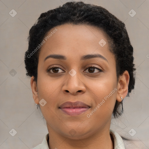 Joyful black young-adult female with short  brown hair and brown eyes