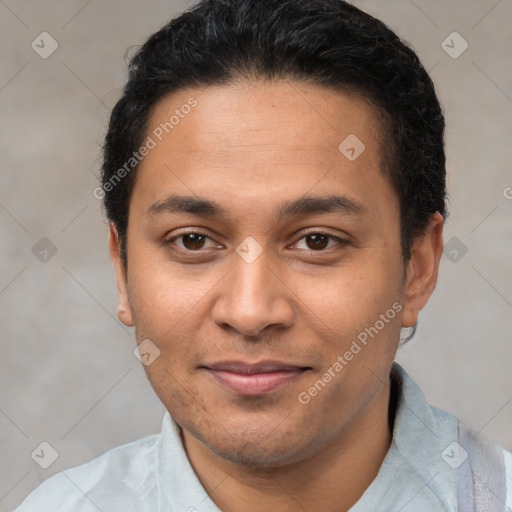 Joyful latino young-adult male with short  brown hair and brown eyes