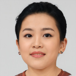 Joyful asian young-adult female with short  black hair and brown eyes