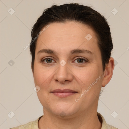 Joyful white adult female with short  brown hair and brown eyes