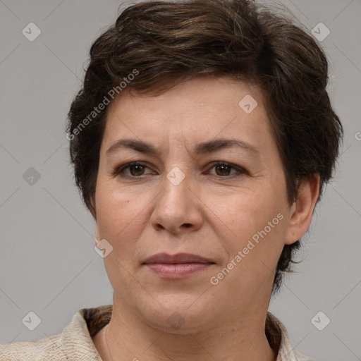 Joyful white adult female with short  brown hair and brown eyes