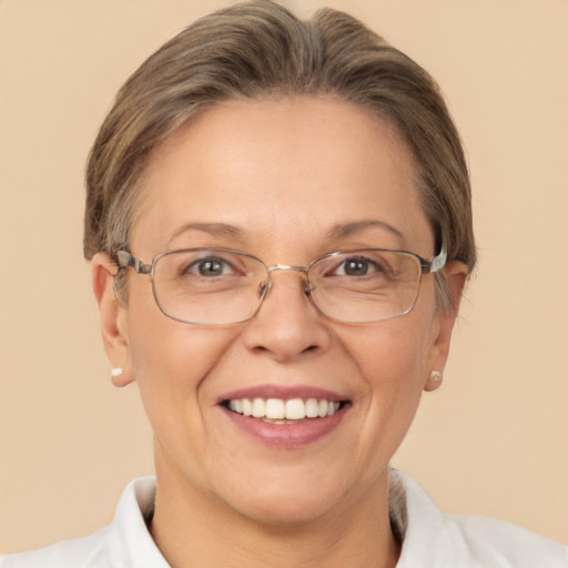 Joyful white adult female with short  brown hair and brown eyes