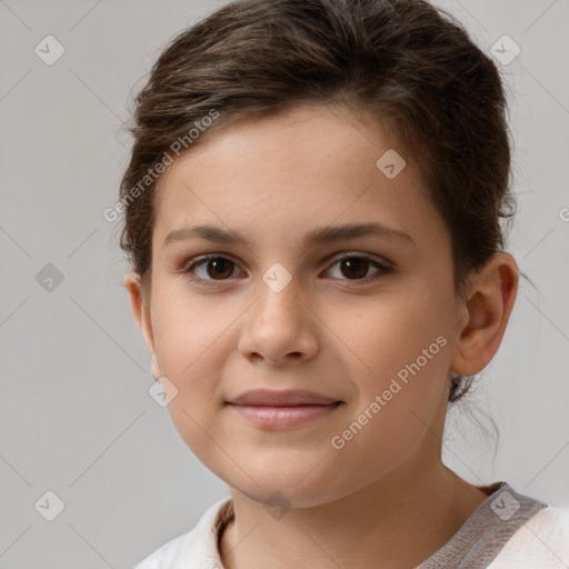 Joyful white child female with short  brown hair and brown eyes