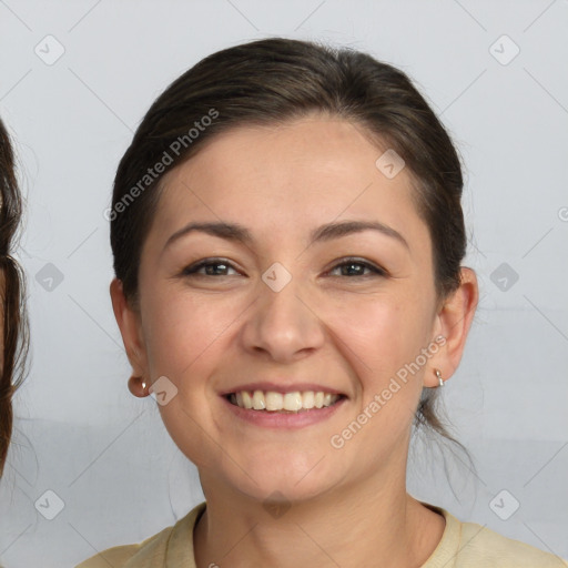 Joyful white young-adult female with medium  brown hair and brown eyes