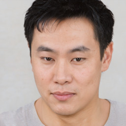 Neutral asian young-adult male with short  black hair and brown eyes