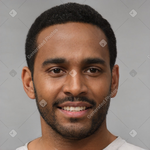 Joyful black young-adult male with short  black hair and brown eyes