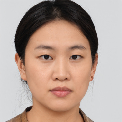 Neutral asian young-adult female with medium  brown hair and brown eyes