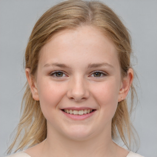 Joyful white child female with medium  brown hair and blue eyes