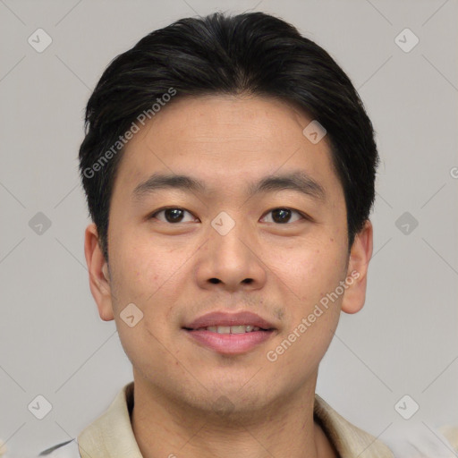 Joyful asian young-adult male with short  brown hair and brown eyes