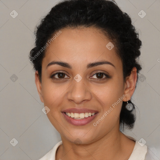 Joyful latino young-adult female with short  brown hair and brown eyes