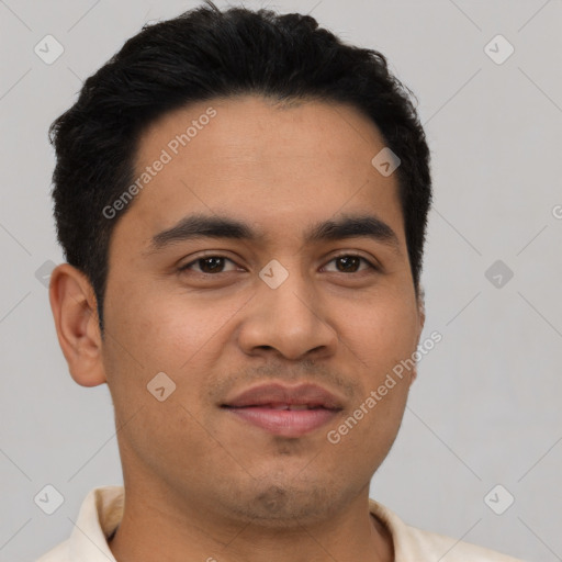 Joyful latino young-adult male with short  black hair and brown eyes