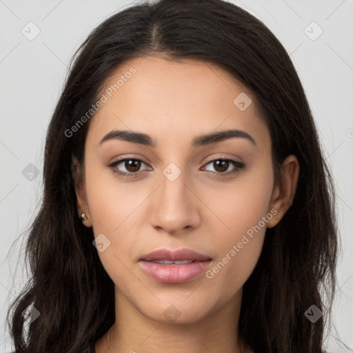 Joyful latino young-adult female with long  brown hair and brown eyes