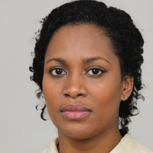 Neutral black young-adult female with medium  black hair and brown eyes