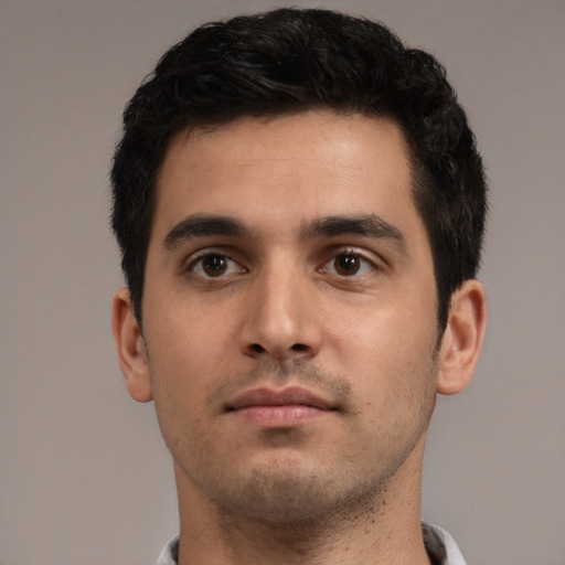 Neutral white young-adult male with short  black hair and brown eyes