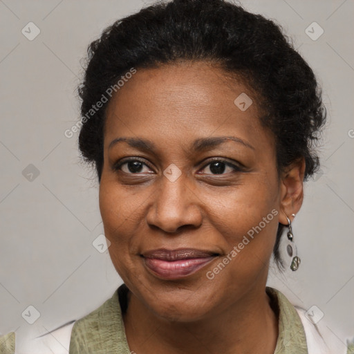 Joyful black adult female with medium  brown hair and brown eyes