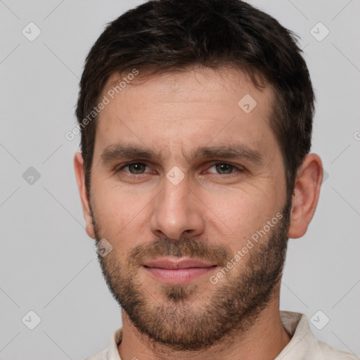 Joyful white adult male with short  brown hair and brown eyes