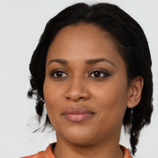 Joyful black young-adult female with medium  black hair and brown eyes