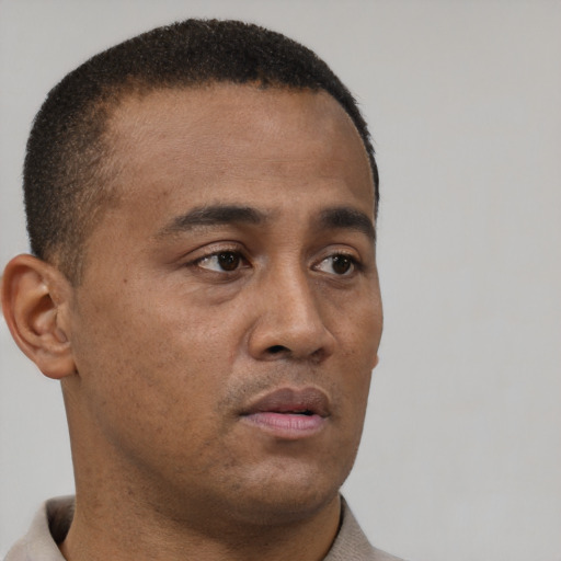 Neutral black young-adult male with short  brown hair and brown eyes