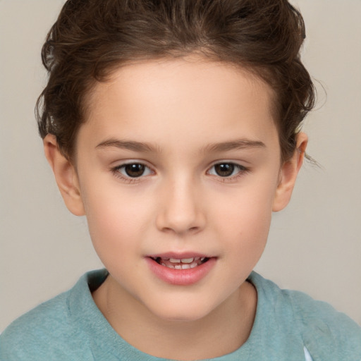 Joyful white child female with short  brown hair and brown eyes