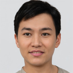 Joyful asian young-adult male with short  black hair and brown eyes