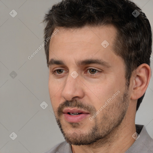 Joyful white adult male with short  brown hair and brown eyes