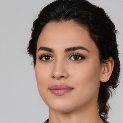 Joyful white young-adult female with medium  black hair and brown eyes