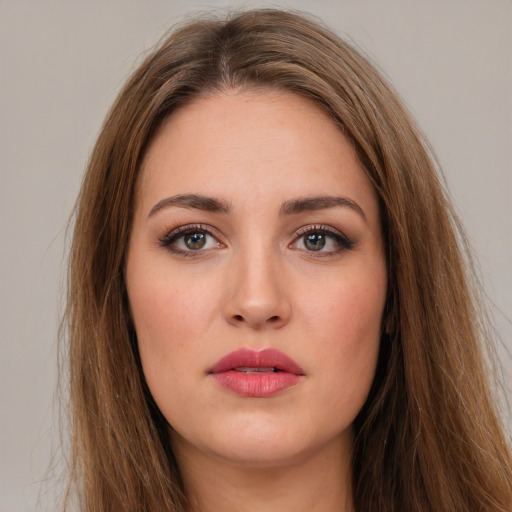 Neutral white young-adult female with long  brown hair and brown eyes