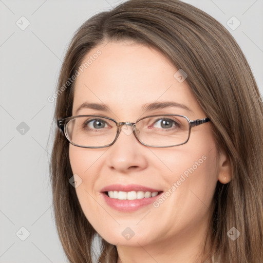 Joyful white young-adult female with long  brown hair and grey eyes